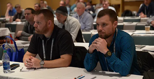 AGG1 features over 120 education sessions Image of people sitting in a meeting room